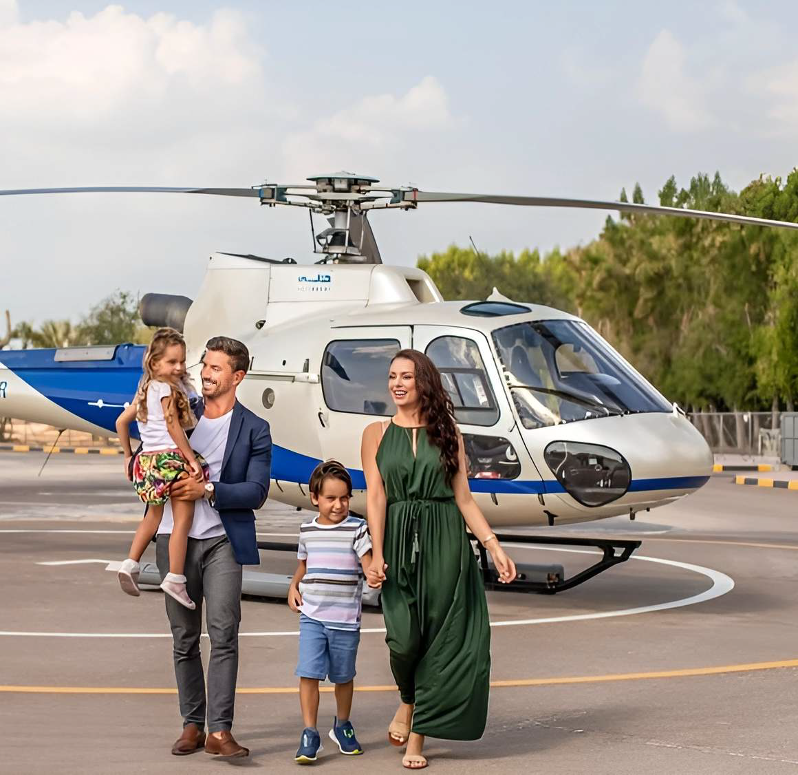 Private helicopter flying above Dubai with aerial views of the city skyline and coastline