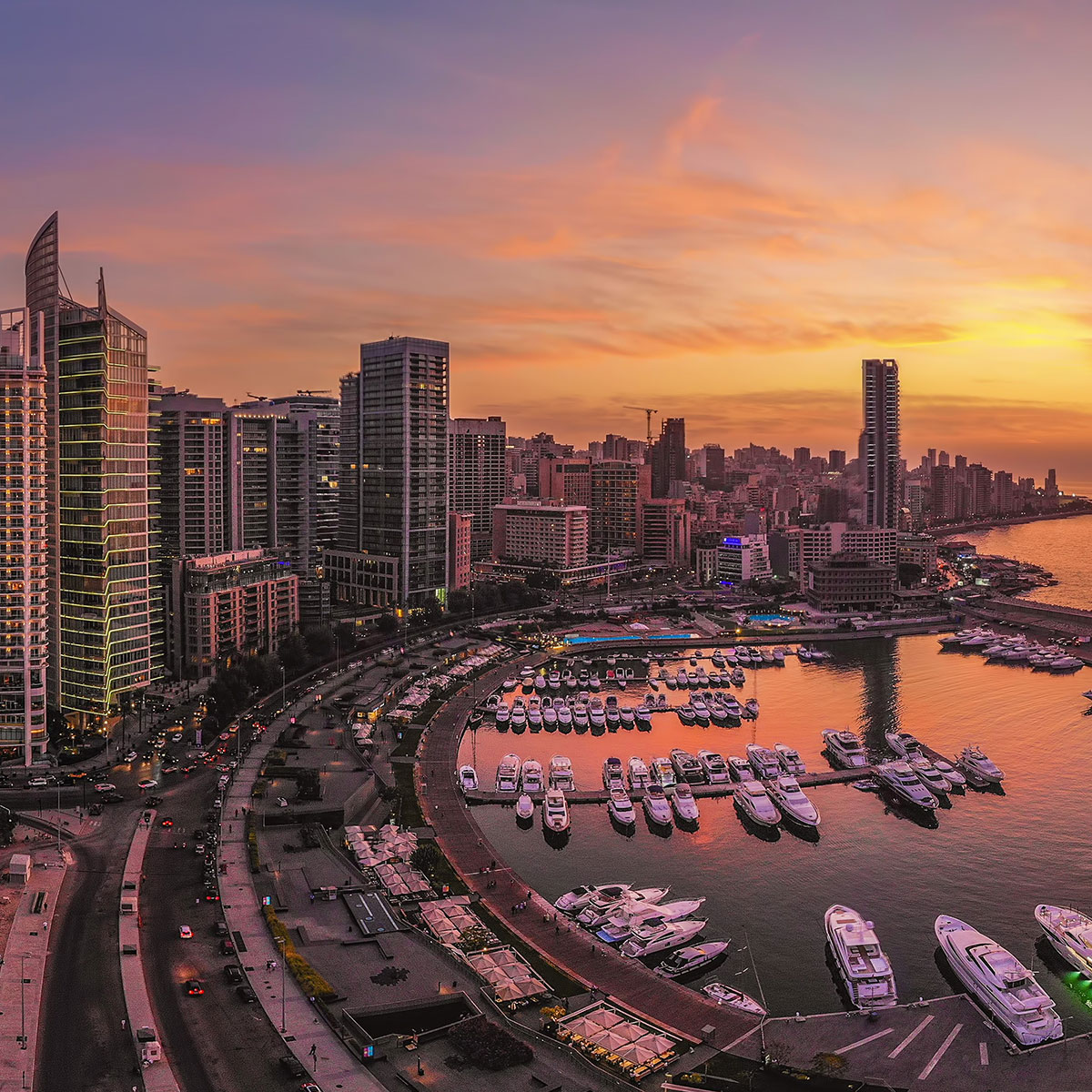 Aerial view of Zaitunay Bay in Beirut at sunset with marina, waterfront promenade, and city skyline