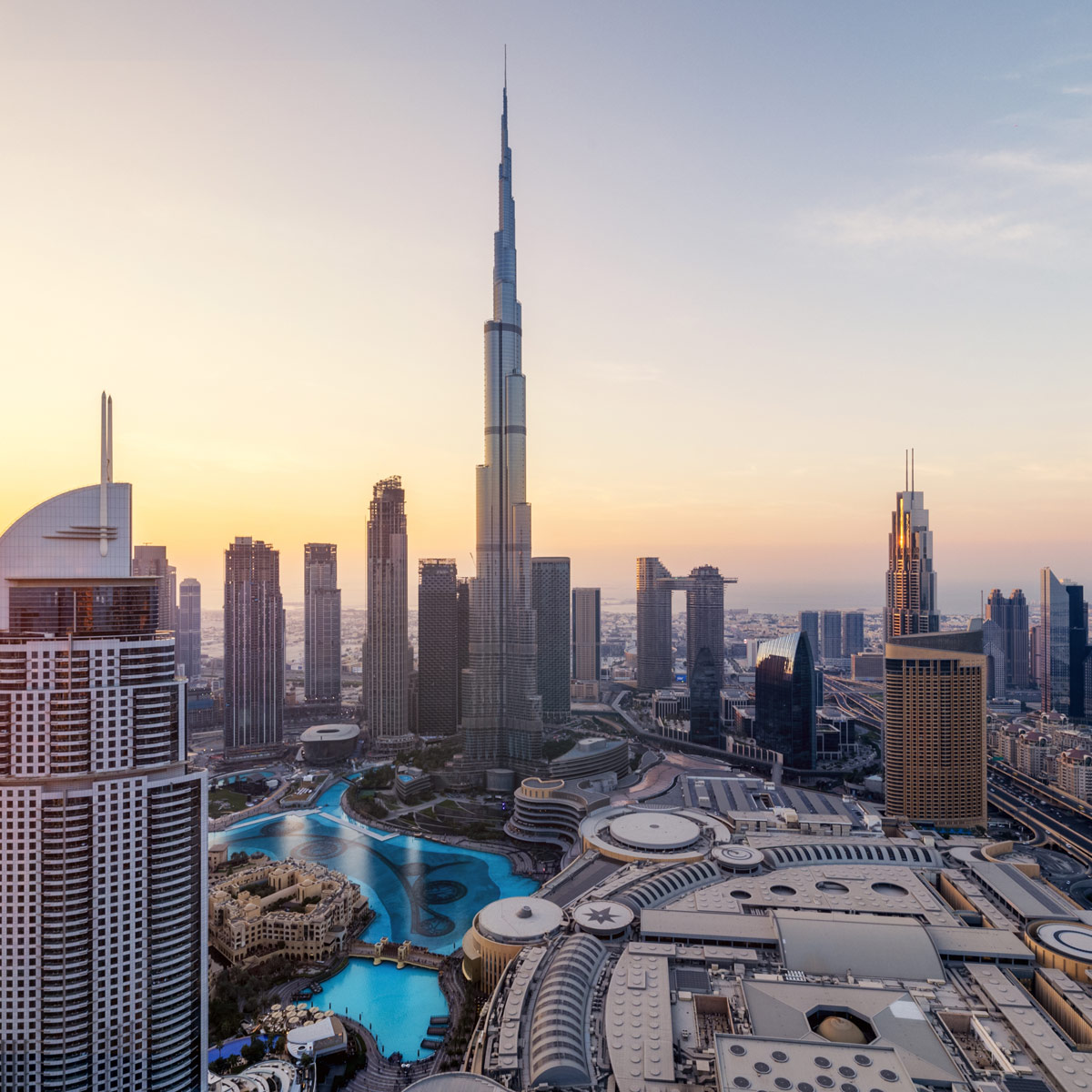 Dubai downtown skyline with Burj Khalifa and modern city architecture at sunset